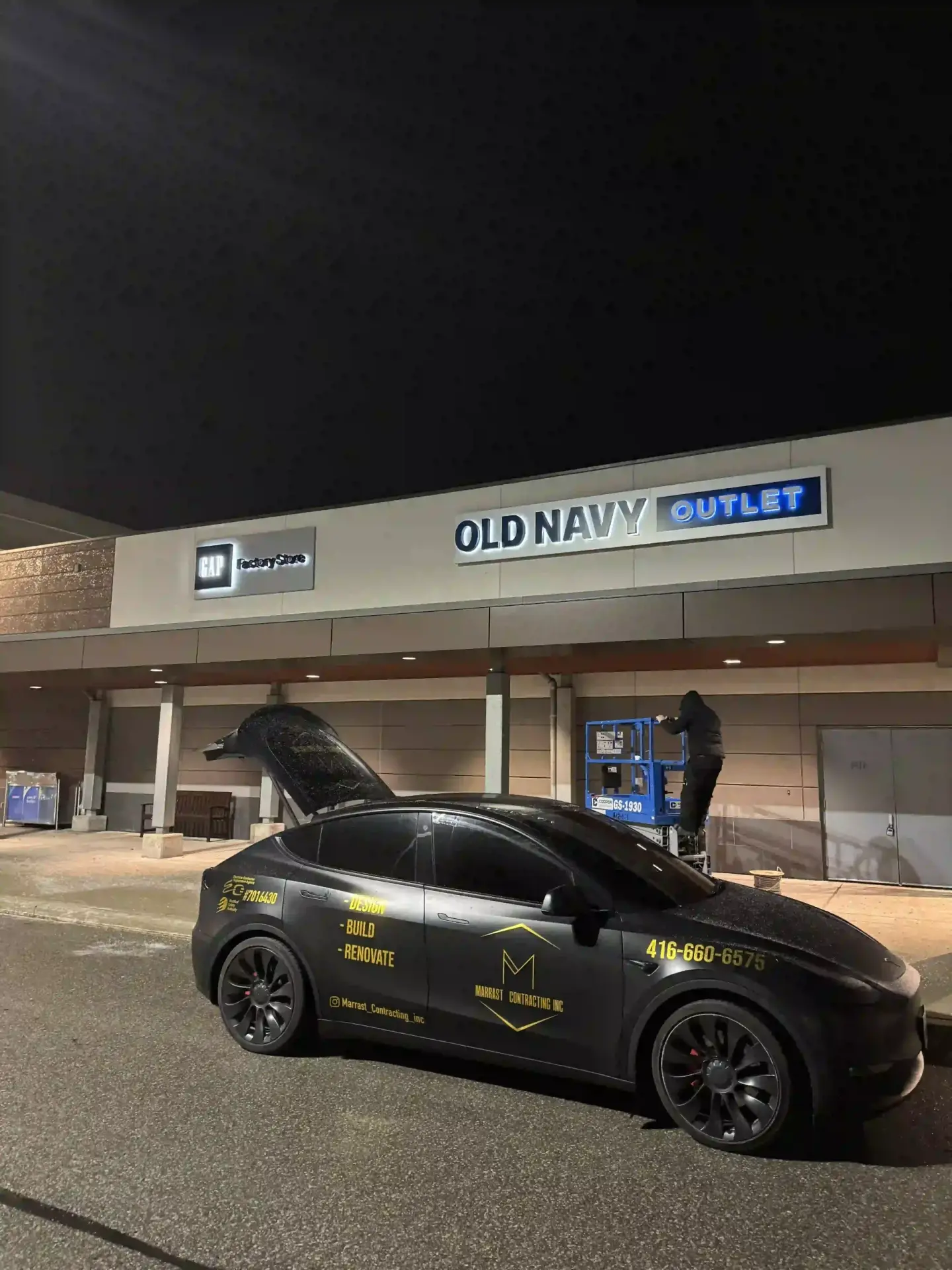 Marrast Contracting vehicle at a commercial building at night