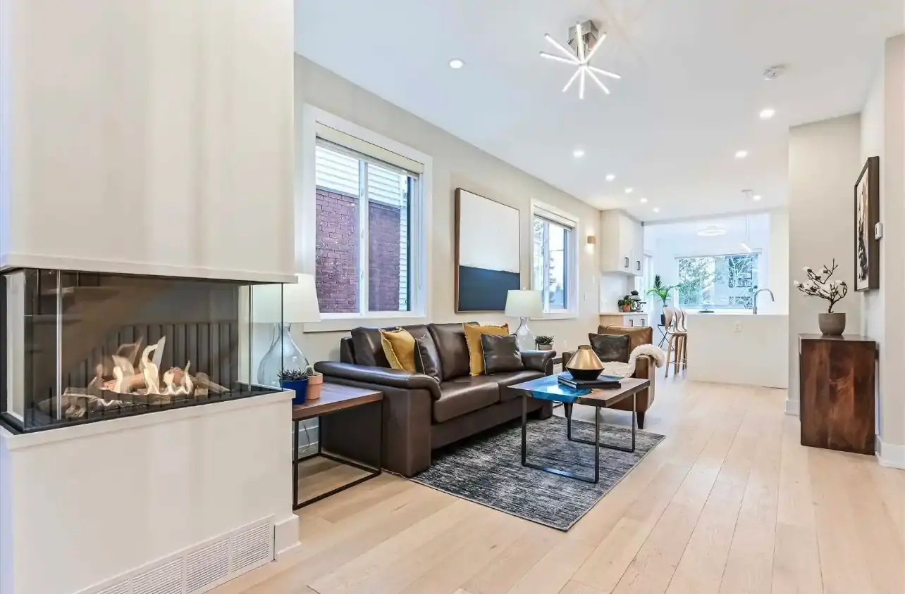 Living room with recessed pot lights and feature lighting