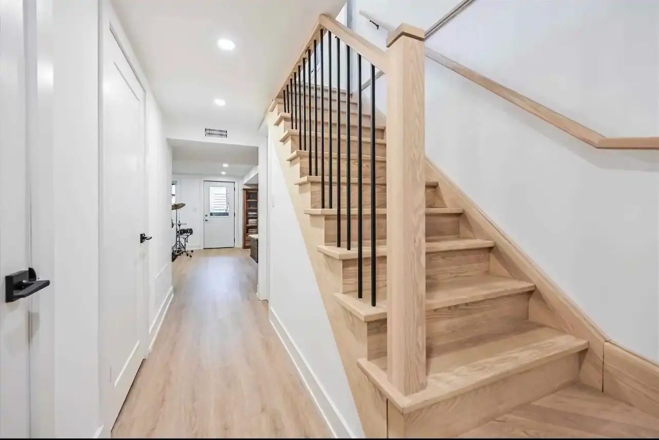 Stair lighting in a custom home wired by Marrast Contracting