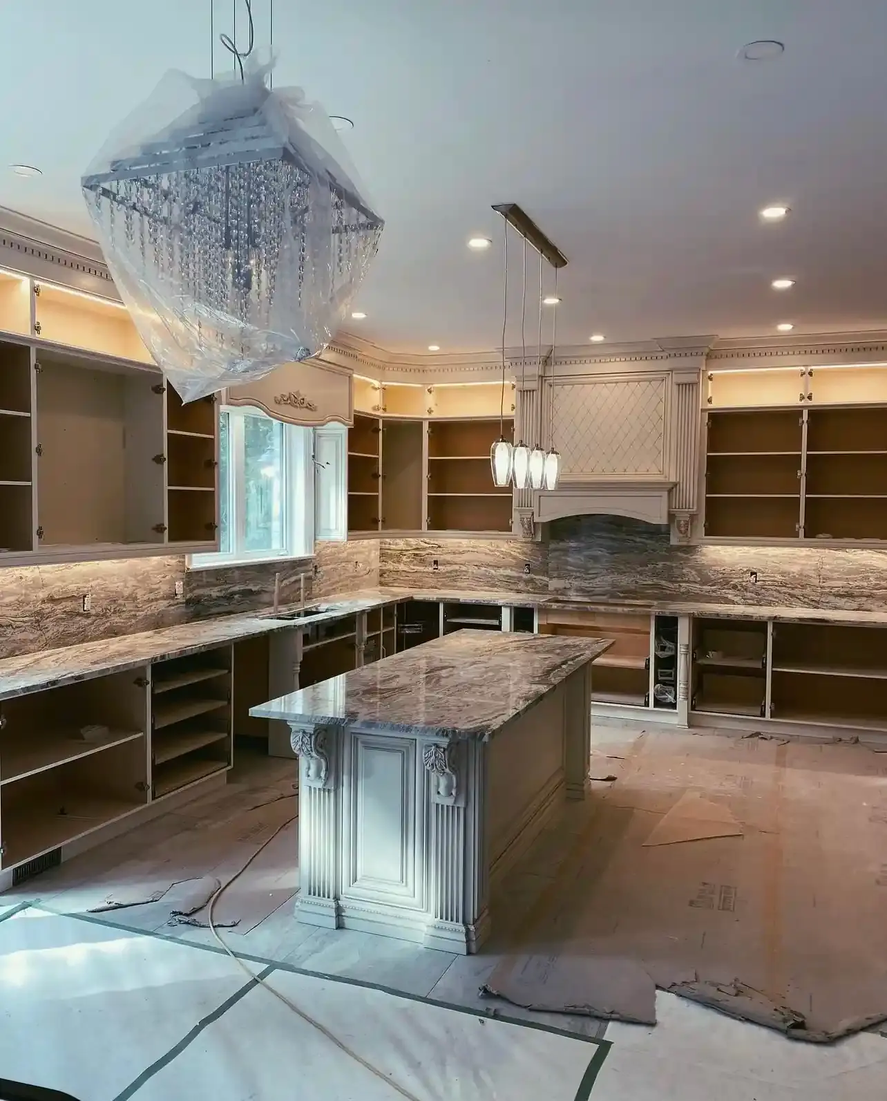 Kitchen renovation in progress with walls and ceiling opened up